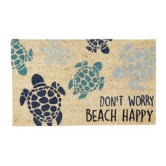 a door mat that says don't worry, beach happy with sea turtles on it