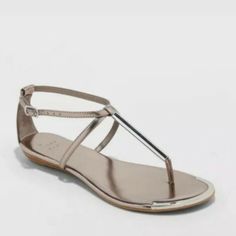 A New Day Archer Pewter Silver T-Strap Thong Flat Sandals Womens Size 8.5 - New With Box Silver T-strap Sandals For Summer Parties, Silver T-strap Sandals For Spring, Elegant Silver T-strap Sandals For Spring, Elegant Silver T-strap Sandals For Summer, Woman Archer, Black High Heel Sandals, Clear Sandals, Purple Sandals, Tassel Sandals