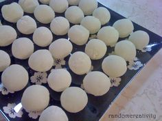 there are many small balls of food on the plate and ready to be cooked in the oven