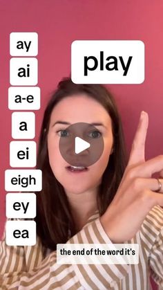 a woman is holding up her fingers to spell out the words in front of her