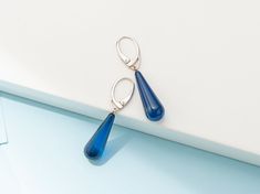 These unique Earrings are made of Precious Azure Amber. Handmade, Sterling Silver 925, Drop shaped, Blue Color. It is the perfect modern detail that will add Character to the look of a contemporary Person. PRODUCT DETAILS: ◾Color: Blue Color ◾Materials: Precious Azure Amber ◾Weight: ~ 3 gr WHERE TO FIND US? ◾Etsy: www.etsy.com/shop/AmberInnovators ◾Facebook: @AmberByMazukna ◾Instagram: @AmberByMazukna ◾Twitter: @AmberByMazukna ◾Website: www.amberbymazukna.com Blue Sterling Silver Teardrop Pierced Earrings, Blue Teardrop Fine Jewelry Earrings, Modern Blue Long Drop Earrings, Modern Blue Long Drop Jewelry, Blue Nickel-free Drop Earrings, Modern Blue Teardrop Earrings, Blue Drop Earrings With Ear Wire, Modern Blue Teardrop Jewelry, Modern Sapphire Sterling Silver Earrings