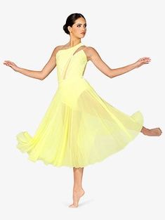 a woman in a yellow dress is dancing with her arms outstretched and legs spread out