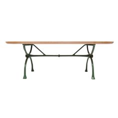 a wooden table sitting on top of a metal frame with two legs and an iron base