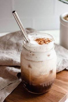 a glass jar filled with liquid on top of a wooden cutting board