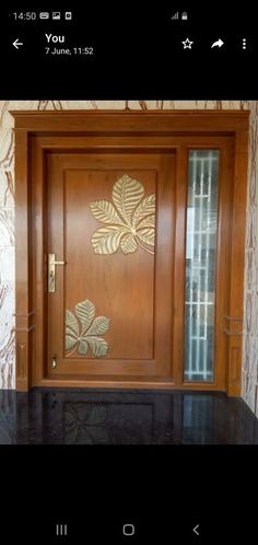 an image of a wooden door with decorative designs on the front and side paneling