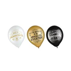 three balloons with the words happy birthday and absolute legend written on them in gold, white, and black