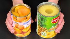 two hands hold cans of pineapple and melon juice