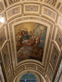 an ornate ceiling with paintings on it