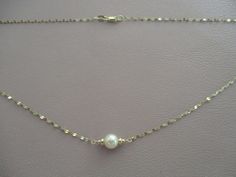 This necklace has a 6mm vintage pearl from my early 1970's collection in the center of 14k solid gold beads and 1.3mm wide sparkly sequin chain with a 14k solid gold lobster claw clasp. Gold Pearl Necklace, Vintage Pearls, Pearl Chain, Gold Pearl, June Birth Stone, Gold Beads, Chain Styles, Solid Gold, Pearl Necklace