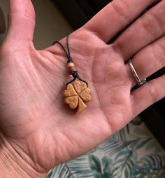 Shamrock Carved from Avocado Pit. -All pendants when dry and hard as wood are then sanded, treated with olive  oil & sealed. All colors are natural of the avocado stone.  -The pendants come with about 3 ft of hemp cord for you to adjust desired necklace length. -Avocado stones have been carried to promote love, beauty and aphrodisiac qualities since the 8th century!  -I try to make my packages as recycled and plastic free as possible. Vegan friendly. *Thank you for stopping by! Avocado Pit Carving, Avocado Carving, Avocado Jewelry, Wood Whittling, Avocado Pit, Shamrock Necklace, Collar Hippie, Avocado Art, Opalite Necklace