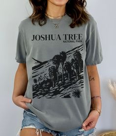 "Joshua Tree National Park Shirt National Park Gift California Shirt Vintage Comfort Color Shirt Travel Gift Tee Order Instructions: 1. Check and review all photos 2. Select the shirt size and shirt color from drop down menus 3. Click \"Add to cart.\" You can also go back to add more products or you can complete the checkout process. 4. Click \"Proceed to check out.\" Product Description: Unisex garment-dyed t-shirt made with 100% ring-spun cotton. The soft-washed fabric brings extra coziness wh Gray Summer Shirt With Screen Print, Summer Gray Shirt With Screen Print, Cotton Graphic Tee Camp Shirt With Letter Print, Cotton Camp Shirt With Letter Print, National Park Gifts, National Park Shirt, California Shirt, California Travel Road Trips, Joshua Tree National Park