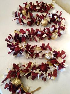 gold and burgundy christmas garlands on a table with text overlay that reads, gold and burgundy christmas garland