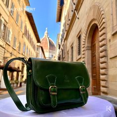 This bag has been made of the best genuine leather by local master crafters of Florence in Italy, designed for women who only accept premium Italian quality and luxury leather bags and modern Italian fashion. . Size: Width:   27 cm/10.75 inch Height:  18 cm/7 inch Depth:    11 cm/4.25 inch Color: Green . The story of this bag :  Once upon a time, there was a young couple, Luca and Maria, who lived in Florence, Italy. They were deeply in love, but they were forced to live apart due to their studi Luxury Bag With Adjustable Strap In Vegetable Tanned Leather, Luxury Vegetable Tanned Leather Bag With Adjustable Strap, Luxury Leather Saddle Bag As Gift, Elegant Green Saddle Bag For Everyday Use, Italian Leather Bag As Gift, Italian Leather Bag As A Gift, Luxury Leather Saddle Bag For Gift, Luxury Leather Saddle Bag Gift, Elegant Green Leather Saddle Bag