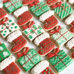 decorated christmas cookies are arranged on a table