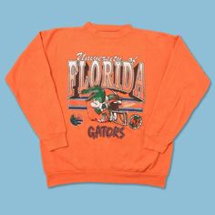 Vintage Ncaa Florida Gators Football Shirt, Florida Gators Shirt, University Of Florida Shirt, Unisex Shirt, Vintage Shirt Product Details Unisex Graphic Tee For Men & Women Lightweight, Extremely Comfortable, And Durable Cotton Blend Fabric Machine Wash At 30c. Do Not Tumble Dry. Wash Inside-Out In Cool Water With Similar Colors Using A Gentle Cycle. Do Not Wash Within 24 Hours Of Receiving. S H I P P I N G Orders Are Shipped As Soon As Possible Please Check Listing. Usps Signed For Delivery Av Collegiate Orange Crew Neck Top, Orange Collegiate Crew Neck Top, Vintage Long Sleeve Fan Gear Tops, Casual Orange Fan Merchandise Top, Orange Graphic Print Top For College, Casual Orange College Tops, Casual Orange Tops For College, Orange Crew Neck Top For Fans, Orange Long Sleeve Top For College