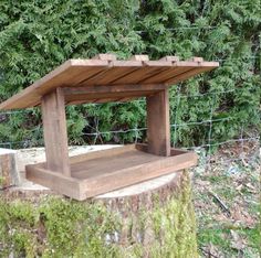 a wooden bench sitting on top of a tree stump