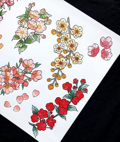 some flowers and hearts on a white paper