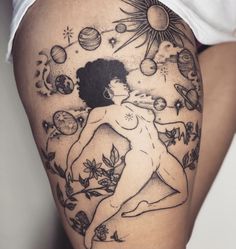 a woman's thigh with an image of the sun and planets on her side