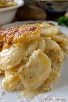 a close up of a plate of food with bananas and cheese on it's side