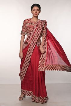 Red handloom silk saree with block print and gujrati sindhi thread and mirror hand embroidered borders. Comes with blouse and a belt.
Components: 2
Pattern: Block printed, Hand embroidered
Type Of Work: Thread, Mirror
Neckline: Round
Sleeve Type: Half
Fabric: Handloom silk
Color: Red
Other Details: 
Heavily embroidered blouse
Occasion: Sangeet - Aza Fashions Festive Red Pre-draped Saree With Pallu, Semi-stitched Tussar Silk Choli With Dori Work, Red Chanderi Pre-draped Saree With Zari Work, Navratri Pre-draped Saree With Cutdana, Traditional Pre-draped Saree With Dori Work For Eid, Traditional Designer Pre-draped Saree For Navratri, Red Unstitched Pre-draped Saree For Diwali, Red Pre-draped Saree With Resham Embroidery For Festivals, Festive Red Chanderi Pre-draped Saree