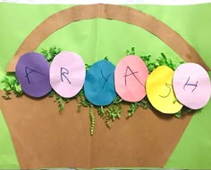 a paper bag with the word art spelled out in front of it and some plants