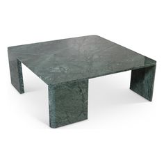 a green marble coffee table sitting on top of a white floor