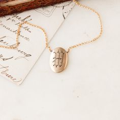 This one-of-a-kind necklace is composed of: Victorian men's cufflink from the late 1800s that features a hand-engraved "W" initial. This necklace measures a standard 18” on a modern 14k gold filled chain, with the cufflink measuring .75” in height. Minimalist Etched Jewelry For Anniversary, Silver Brass Jewelry With Engraving Option, Timeless Engraved Jewelry For Formal Occasions, Adjustable Sterling Silver Jewelry Stamped 14k, Adjustable Yellow Gold Initials Necklace, Etched Sterling Silver Jewelry In Yellow Gold, Adjustable Yellow Gold Necklaces With Initials, Yellow Gold Etched Sterling Silver Jewelry, Classic Pendant Necklace With Etched Details