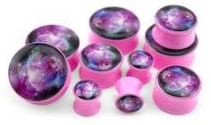 six pink and purple space - themed knob covers