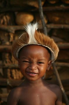 a young child with a mohawk on top of his head