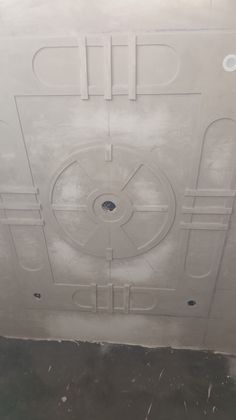 the inside of a door that has been painted with white paint and some holes in it