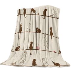 a blanket with cats on it is shown