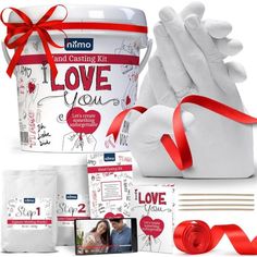 a couple's wedding gift set with red ribbon