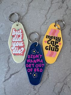 three key chains that say, but did you club? and didn't wanna get out of bed