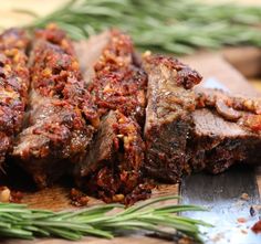 some meat is sitting on a cutting board