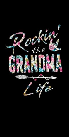 rockin'the grandma life with an arrow and flowers on it in multicolored letters