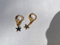 "FIRST TIME DISCOUNT: USE CODE FIRSTTIME20 FOR 20% YOUR FIRST ORDER! ♡ ALL PACKAGING IS 100% RECYCLABLE, BIODEGRADABLE, OR MADE FROM 100% RECYCLABLE MATERIALS ♡ ALL ORDERS NOW COME WITH A GIFT BOX! Listing comes with two earrings (aka: one pair) Dimensions: star: 12mm hoop: 11mm entire earring: around 1\" (one inch) long Materials: Gold: 14kt Gold Plated Gold Vermeil Gold Vermeil & CZ (cubic zirconia) 24kt Gold Filled Silver: Silver Plated Sterling Silver Sterling Silver & CZ (cubic zirc Hypoallergenic Star-shaped Everyday Earrings, Hypoallergenic Star Earrings For Everyday, Everyday Hypoallergenic Star Earrings, Minimalist Star-shaped Cartilage Earrings With Star Charm, Hypoallergenic Star-shaped Cartilage Earrings For Everyday, Nickel-free Star-shaped Cartilage Earrings As Gift, Nickel-free Star Cartilage Earrings As Gift, Nickel-free Star-shaped Cartilage Earrings For Gifts, Hypoallergenic Star-shaped Cartilage Earrings For Gift