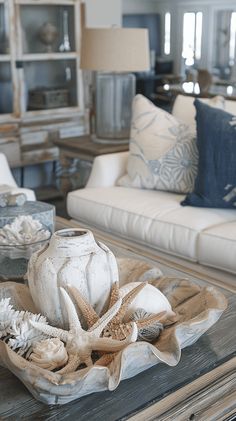 a living room filled with lots of furniture and decor on top of a wooden table