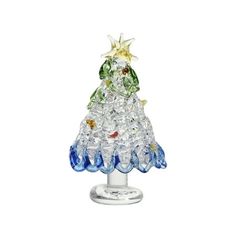 a small glass christmas tree on a stand