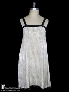 "BIG NEWS After 22 years, our website, TheFROCK.com, has had a makeover. Check out the new site, and join our mailing list for new arrivals.  Vintage Giorgio Armani (mainline) beaded fringe dress in lightweight silk with black velvet trims. Side zippers. Measures 34\" bust, flares to 37\" at waist and then 62\" around at hem, the length is about 34\" at middle and 36.5\" at sides. The dress is partial lined by way of an empire underbodice that is about 29.5\" around at the empire waistline. Cond Beaded Fringe Dress, Cocktail Gowns, Empire Waistline, Velvet Trim, Fringe Dress, Dress Cocktail, Beaded Fringe, Mailing List, Dress Clothes For Women