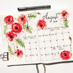 an open planner with watercolor flowers on it