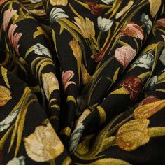 a black and yellow floral print fabric