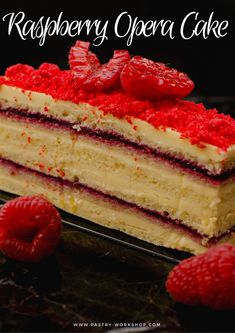 raspberry opera cake with white frosting and fresh raspberries