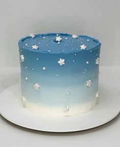 a blue and white cake with stars on it