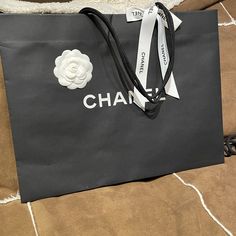 New With Camellias And Ribbon Perfect For A Gift Chanel Shopping, Chanel Black And White, Chanel Bags, Chanel Black, Shopping Bags, Chanel Bag, Chanel, Cute Outfits, Bag Lady