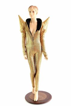 This item is made to order, please read all the way through the listing before purchasing!  This jumpsuit is made of lycra spandex in a sparkling gold and black scale pattern. Long sleeves with MEGA sharp shoulders, and a zipper in the front. The shoulders have conical shoulder pads to keep them upright. Four way stretch for a figure forming fit. This bodysuit is unlined. Inseam: 32    Womens Sizing (See below for instructions on where measurements should be taken)  Extra Small: Bust 31-32 &#... Metallic High Stretch Unitard For Party, Fitted Winter Party Unitard, Stretch Unitard For Winter Party, Stretch Winter Party Unitard, Winter Party Stretch Unitard, Sharp Shoulders, Holographic Fabric, Scale Pattern, Gold Fish