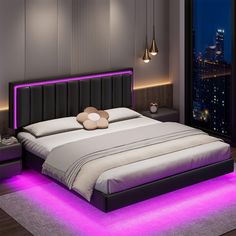 a large bed with purple lights on the headboard and foot board in a bedroom