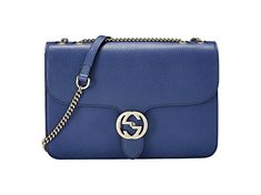 Elevate your look with the Gucci Dollar Interlocking GG Blue Leather Medium Chain Shoulder Bag. Crafted with precision and style, it features a striking blue pebbled leather and the iconic GG flip-lock clasp. Practical yet glamorous, its spacious interior keeps your essentials organized while the sliding chain strap allows versatile styling options. Perfect for any occasion, this bag effortlessly enhances any outfit, making a lasting impression wherever you go. Treat yourself to timeless luxury Chic Blue Bag With Cc Turnlock Closure, Blue Leather Shoulder Bag With Cc Turnlock Closure, Blue Shoulder Bag With Cc Turnlock Closure, Classic Blue Gucci Shoulder Bag, Designer Blue Gucci Shoulder Bag, Gucci Blue Shoulder Bag With Removable Pouch, Blue Handheld Bag With Gold-tone Hardware, Blue Gucci Shoulder Bag With Branded Hardware, Designer Blue Shoulder Bag With Gold-tone Hardware