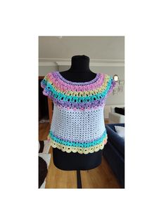 Brighten your wardrobe with this Rainbow Crochet Mesh  Blouse! Handcrafted with care, this vibrant top features a colorful yoke design that's perfect for summer days and festival vibes. Lightweight and breathable, it's the ideal choice for adding a pop of color to any outfit. Step into a world of color with our Rainbow Crochet Yoke Blouse! This handmade top showcases a stunning rainbow pattern with a delicate mesh yoke, blending comfort with boho-chic style. Perfect for layering or wearing on it Multicolor Crew Neck Crochet Top For Summer, Handmade Multicolor Tops For Spring, Multicolor Cotton Tops With Crochet Trim, Multicolor Crochet Lace Cotton Top, Casual Multicolor Crochet Top With Crochet Trim, Multicolor Crochet Cotton Top, Multicolor Short Sleeve Crochet Top For Spring, Multicolor Cotton Crochet Lace Top, Handmade Multicolor Crochet Cotton Top