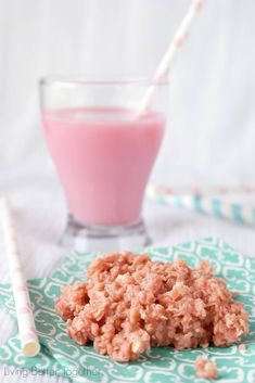 a close up of food on a plate near a glass of milk and straws