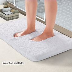 a person standing on a bath mat in front of a shower